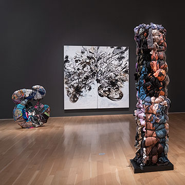 2 fabric sculptures, 1 black and white painting, and a collage of images on display at the Nerman