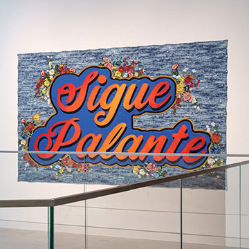 Artwork by Carlos Rolon that says Sigue Palante