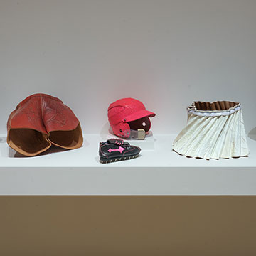 A row of sculptures on display at the Sport and Spectator exhibition at the Nerman Museum of Contemporary Art